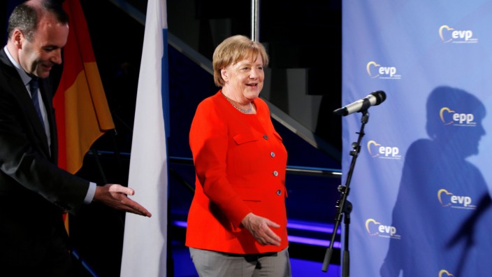 German Chancellor Angela Merkel (CSU) arrives with Manfred Weber at the EPP meeting in Munich