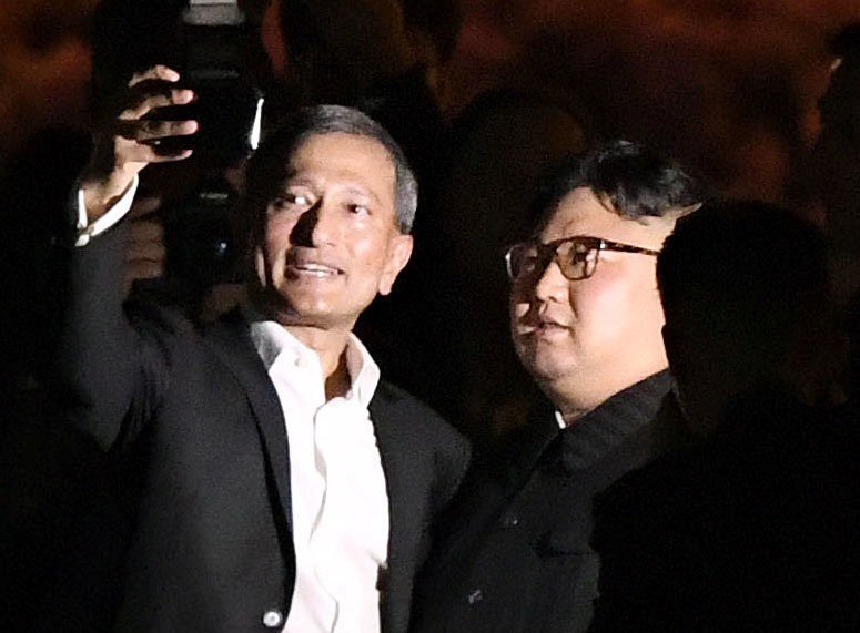 Singapore's Foreign Minister Vivian Balakrishnan takes a selfie with North Korea's leader Kim Jong Un during a visit in Merlion Park in Singapore
