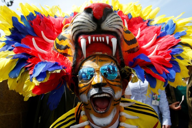 A supporter of the Colombian national soccer team cheers during a gathering on the first day of the 2018 FIFA World Cup in central Moscow