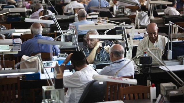 Diamond dealers work on the trading floor of Israel's diamond exchange in Ramat Gan near Tel Aviv