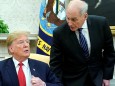 U.S. President Trump talks with White House Chief of Staff John Kelly at the White House in Washington