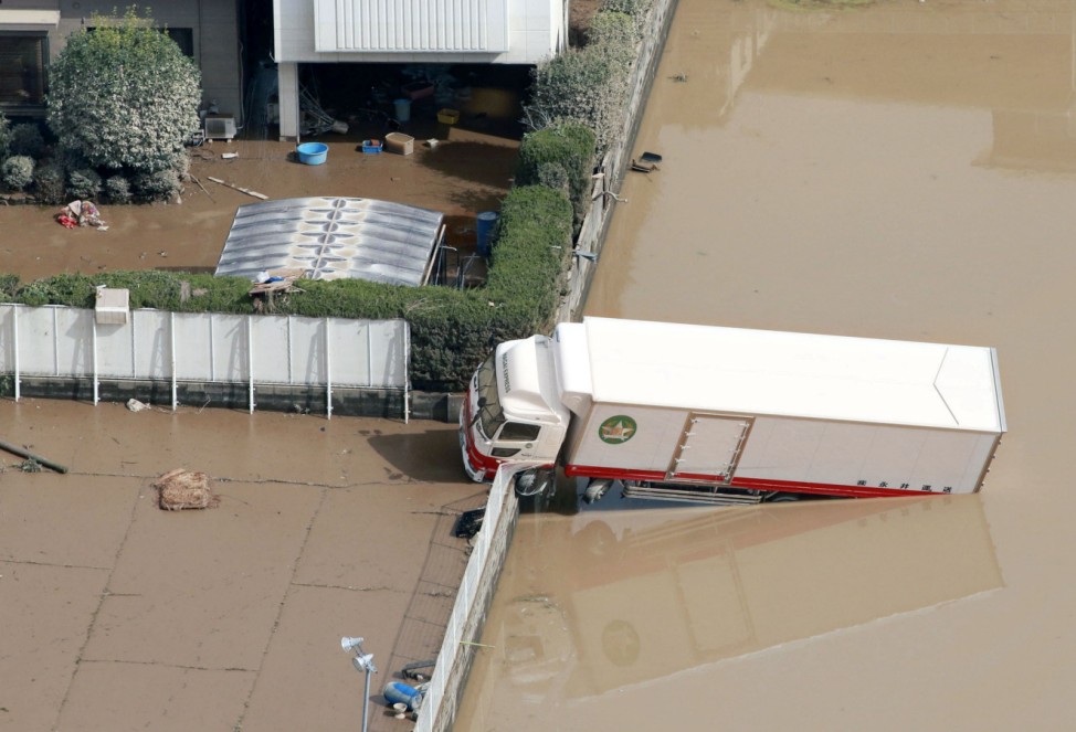 A truck which was stranded by floods is pictured at Mabi town in Kurashiki