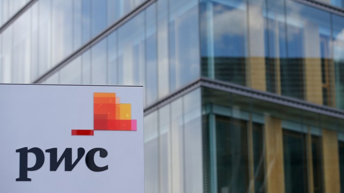 FILE PHOTO: The logo of PwC is seen in front of the local offices building of the company in Luxembourg