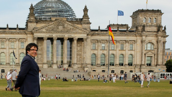 FILE PHOTO: Former Catalan President Carles Puigdemont walks in front of the Bundestag in Berlin