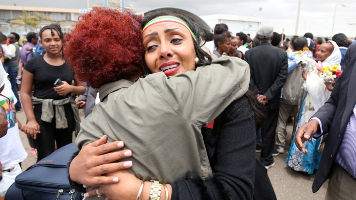 Relatives embrace after meeting at Asmara International Airport