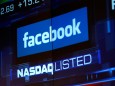 FILE PHOTO: Monitors displays the Facebook, Inc. stock during morning trading at the NASDAQ Marketsite in New York