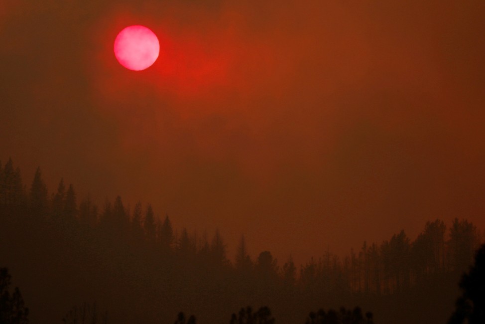 The setting sun is turned red by the smoke from the Carr Fire west of Redding