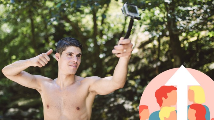 Shirtless young man filming himself with an action video camera in nature model released Symbolfoto