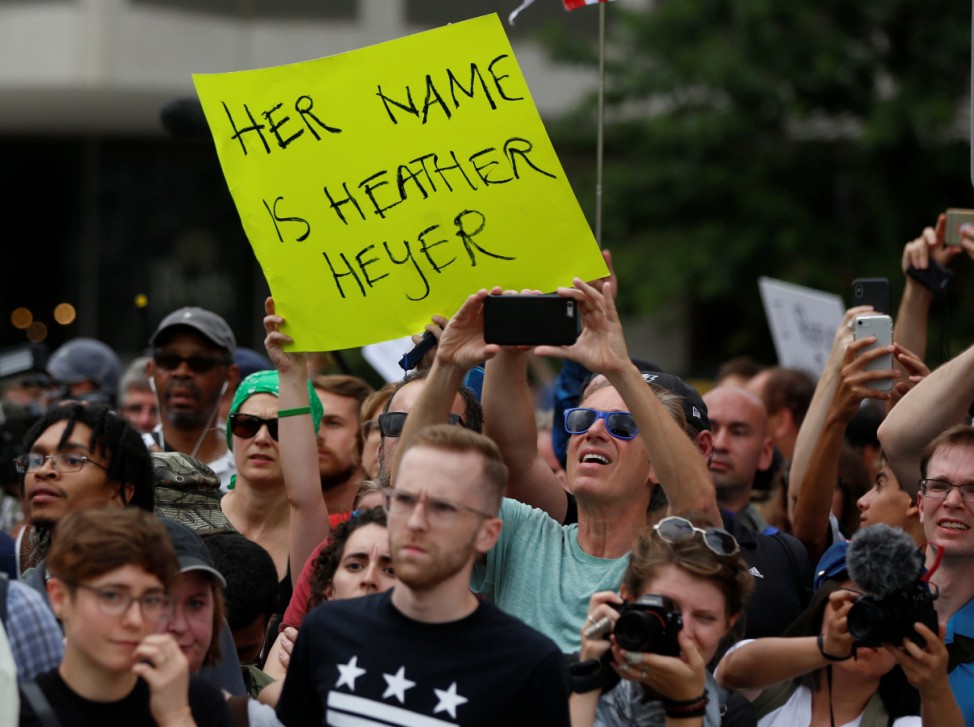 A counter-protester holds a sign near a white nationalist-led rally in Washington