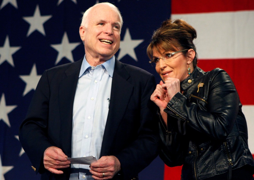 FILE PHOTO -  U.S. Senator John McCain and former Alaska Governor and vice presidential candidate Palin acknowledge crowd during a campaign rally for McCain at the Pima County Fairgrounds in Tucson