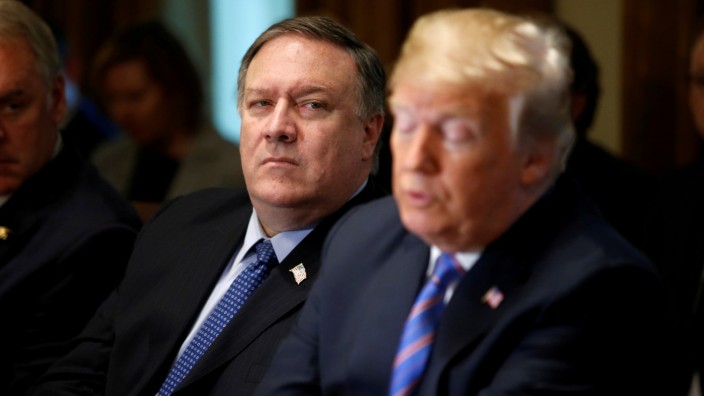 FILE PHOTO:    U.S. Secretary of State Pompeo listens as U.S. President Trump holds cabinet meeting at the White House in Washington