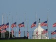 Flags fly at half staff in honor of Senator John McCain (R-AZ) at the Washington Monument in Washington