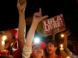 Supporters of former Brazilian president Luiz Inacio Lula da Silva attend a vigil outside the Federal Police Superintendence in Curitiba
