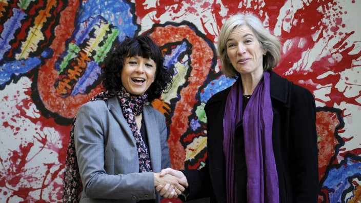 FILE PHOTO: French microbiologist Emmanuelle Charpentier (L) and professor Jennifer Doudna of the U.S. pose for the media during a visit to a painting exhibition by children about the genome, at the San Francisco park in Oviedo