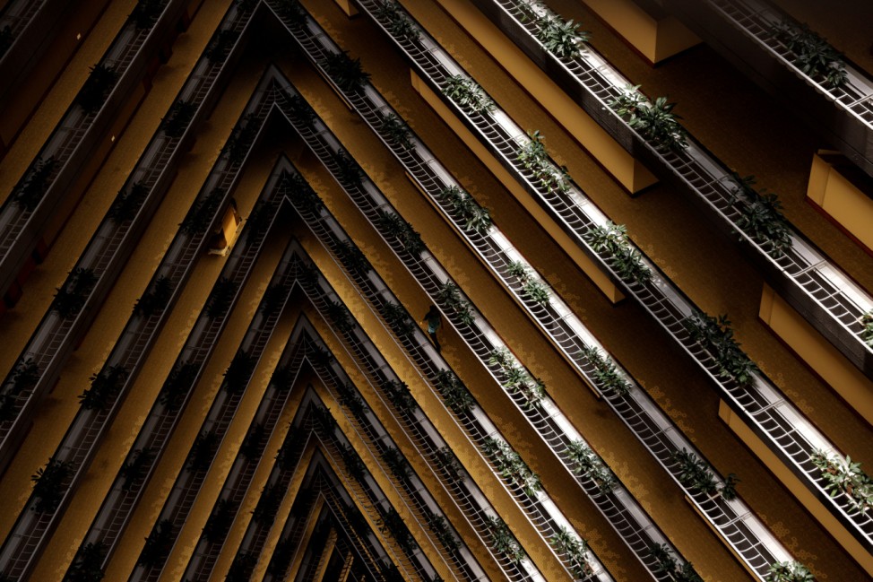 An attendant walks along a corridor at the Pan Pacific Hotel in Singapore