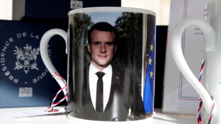 A mug with a picture of French President Macron and the Elysee Palace logo to launch the presidential brand named ''Elysee Presidence de la Republique'' is seen in the courtyard of the Elysee Palace as part of the European Heritage Days event in Paris