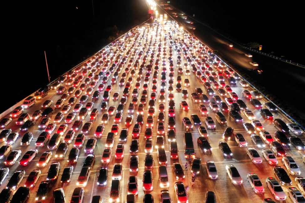 Vehicles are seen jammed on a express way near a toll station, at the end of the Mid-Autumn Festival holiday, in Zhengzhou, Henan