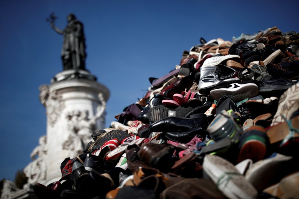 Pile of used footwear is pictured at Place de la Republique during anti-personnel landmine demonstration in Paris