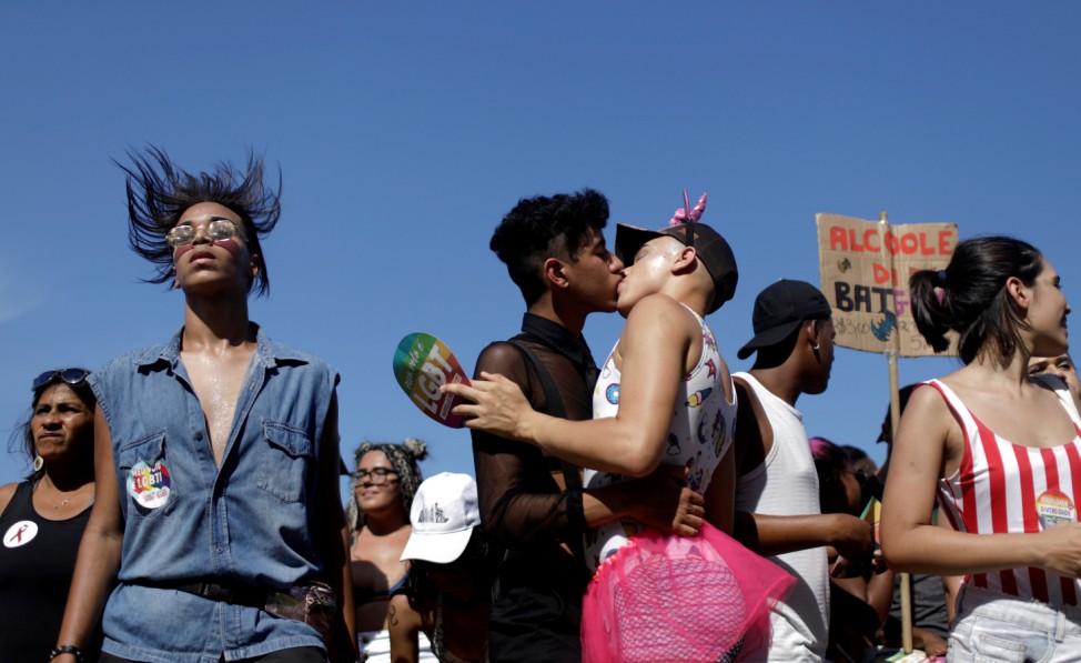 Revellers take part in the Gay Pride Parade at Copacabana beach in Rio de Janeiro