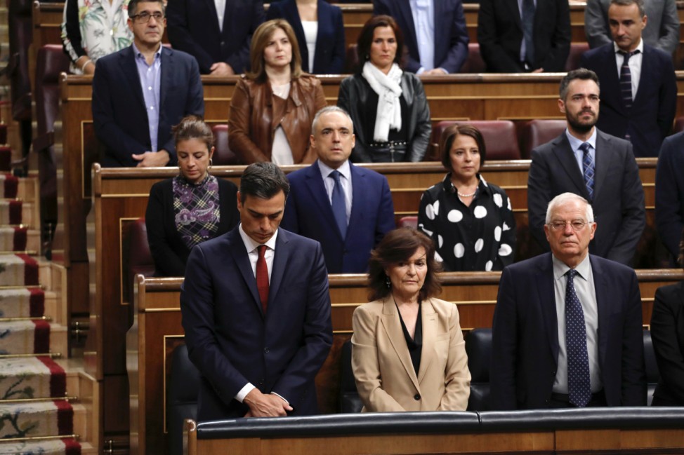 Spain's PM Sanchez and members of Parliament hold a minute of silence for the victims of heavy rains in the Spanish island of Mallorca at the start of a parliamentary session in Madrid