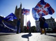 Anti-brexit protestors wave flags outside the Houses of Parliament in London