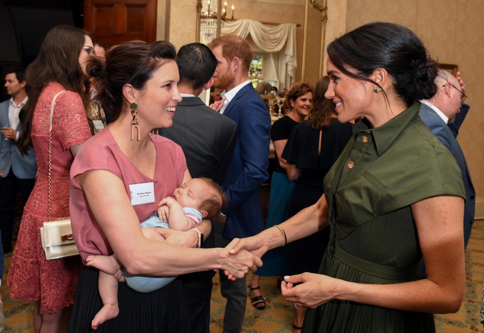 Meghan, Duchess of Sussex talks to Australian Singer Missy Higgins, with her 9 week old baby Lunar, during an afternoon reception hosted by the Governor-General and Lady Cosgrove, in Sydney