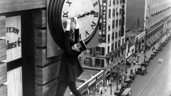 Harold Clayton Lloyd hangs from a clock in Safety Last 1923 Lloyd 1893 - 1971 was an American a