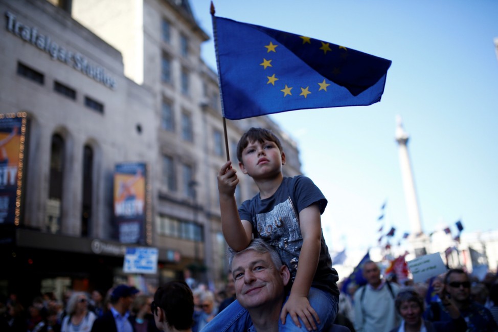 Protesters participating in an anti-Brexit demonstration march through central London
