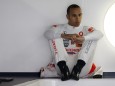 McLaren Formula One driver Lewis Hamilton of Britain sits in his team garage during the first practice session at the Canadian Grand Prix in Montreal