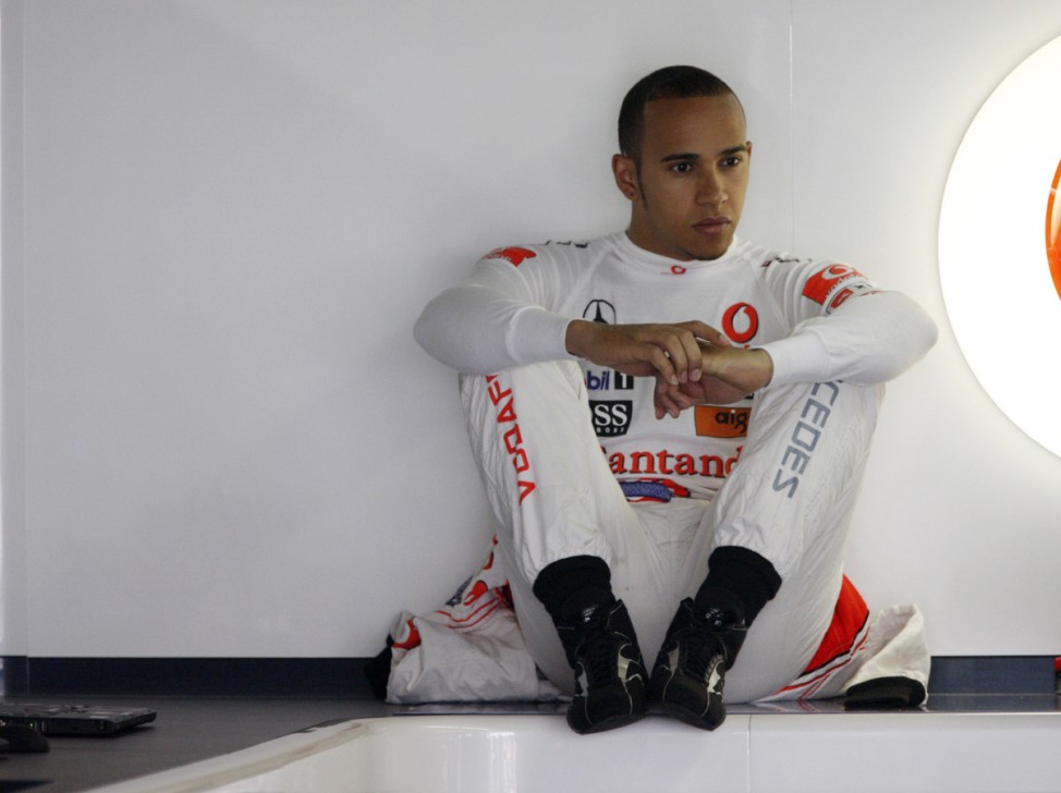 McLaren Formula One driver Lewis Hamilton of Britain sits in his team garage during the first practice session at the Canadian Grand Prix in Montreal
