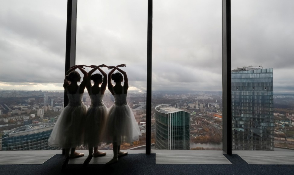 Ballerinas perform during an ice-cream factory promotional event at an observation floor of the Moscow International Business Centre in Moscow