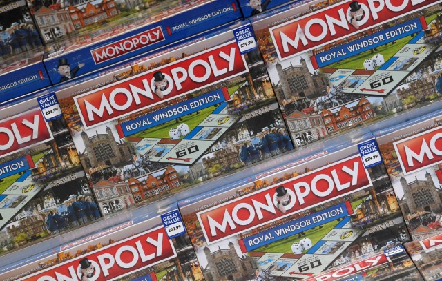Monopoly board games can be seen for sale in a shop window, on the day before the royal wedding of Britain's Princess Eugenie and Jack Brooksbank, in Windsor