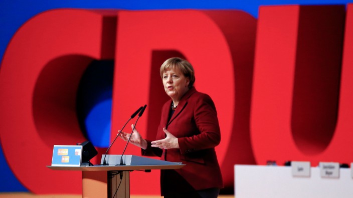 FILE PHOTO: German Chancellor and leader of the Christian Democratic Union Merkel makes a closing statement during the second day of the CDU party congress in Karlsruhe