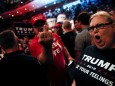 FILE PHOTO: Supporters of Republican U.S. presidential nominee Donald Trump scream and gesture at members of the media in a press area at a campaign rally in Cincinnati