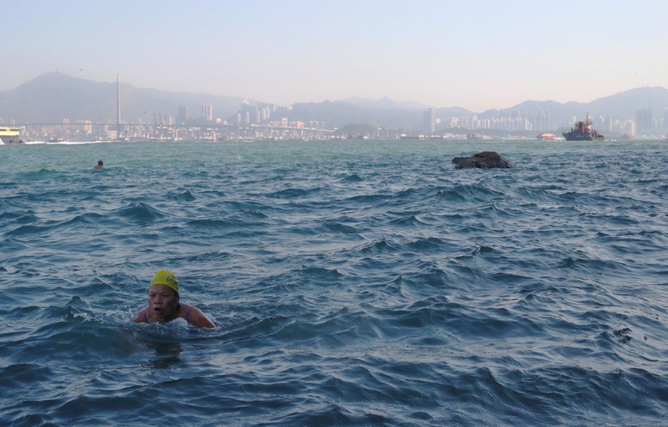 The Wider Image: Hardy Hong Kong swimmers brave busy harbour