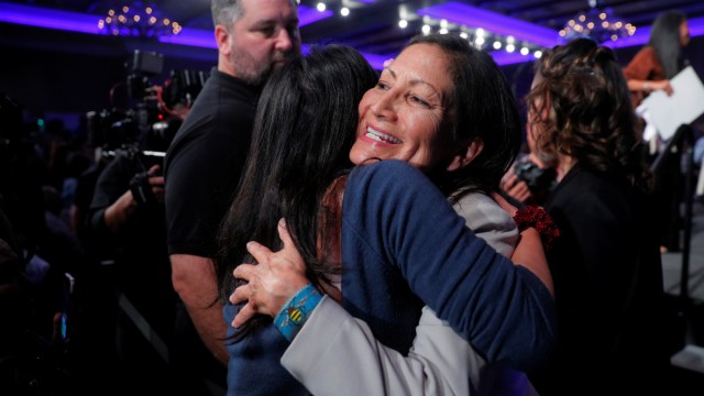 U.S. Democratic Congressional candidate Deb Haaland hugs a supporter after winning her midterm election in Albuquerque