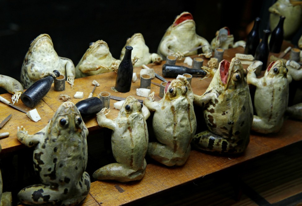 Frogs representing eating at an electorate diner are pictured at the Frog Museum in Estavayer-le-Lac