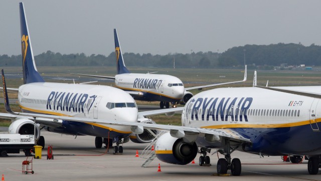 FILE PHOTO: Ryanair airplane taxis past two parked aircraft at Weeze Airport