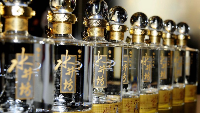 Bottles of Sichuan Swellfun baijiu are seen on display during a promotional event of the company in Beijing