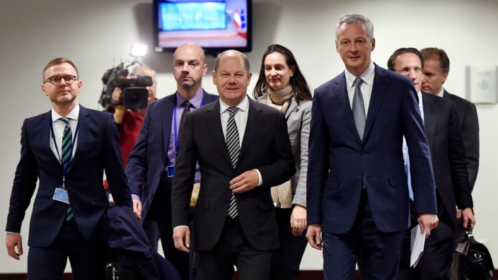 French Economy Minister Le Maire and German Finance Minister Scholz arrive for a news conference in Brussels