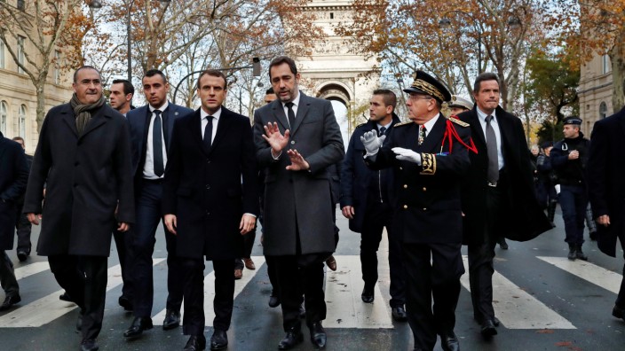 France's President Emmanuel Macron arrives to visit firefighters and riot police officers the day after a demonstration