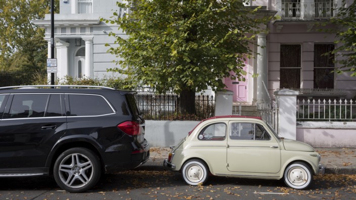 Small And Large Car In Notting Hill