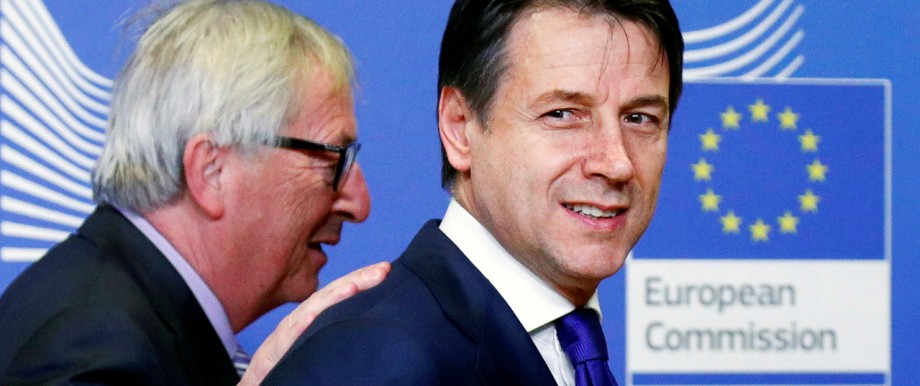 FILE PHOTO: Italian Prime Minister Giuseppe Conte (right) with European Commission President Jean-Claude Juncker in Brussels