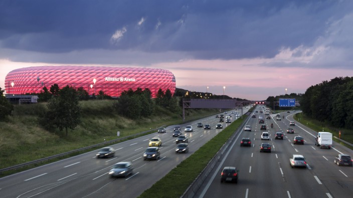 Germany Munich traffic on motorway with lighted Allianz Arena in the background PUBLICATIONxINxGER