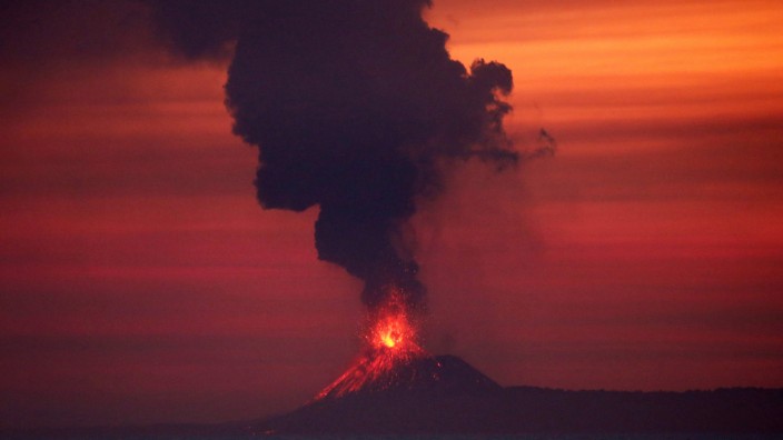 Anak Krakatau (Child of Krakatoa) volcano is seen from Japanese helicopter carrier Kaga at the Indian Ocean