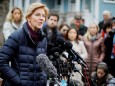 U.S. Senator Warren speaks to reporters outside her home in Cambridge