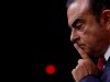 FILE PHOTO: Carlos Ghosn, Chairman and CEO of the Renault-Nissan Alliance, reacts during a news conference in Paris