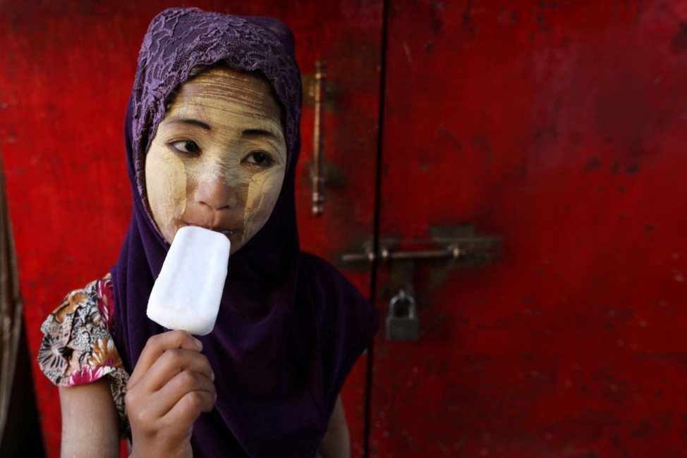 Girl eats a popsicle during Myanmar's 71st Independence Day in Yangon