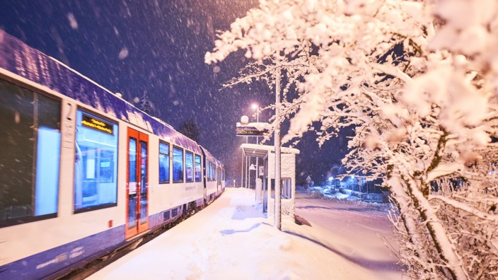 Train stop Marktoberdorf school covered in heavy onset of winter and snowfall in the morning in Mar