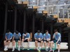 Spieler des Teams sitzen nach dem Training auf einem Transportwagen in der Halle Handball Oeffentli